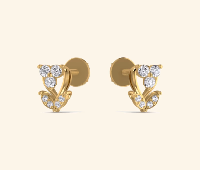 Pavé-set diamond stud earrings with halo silhouette.