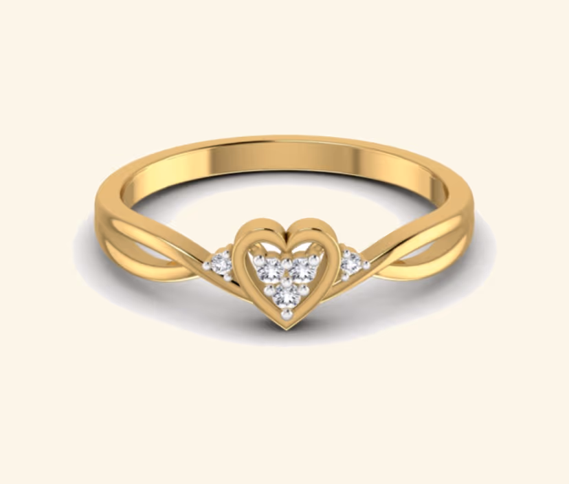 Heart-form diamond ring with central pavé cluster.