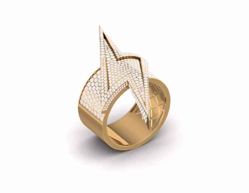 Pavé lightning-bolt motif sweeping diagonally across a wide gold ring.