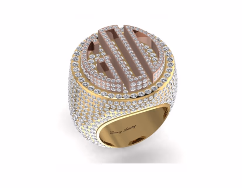 Domed iced signet with a raised monogram and inner Luxury Artistry engraving.