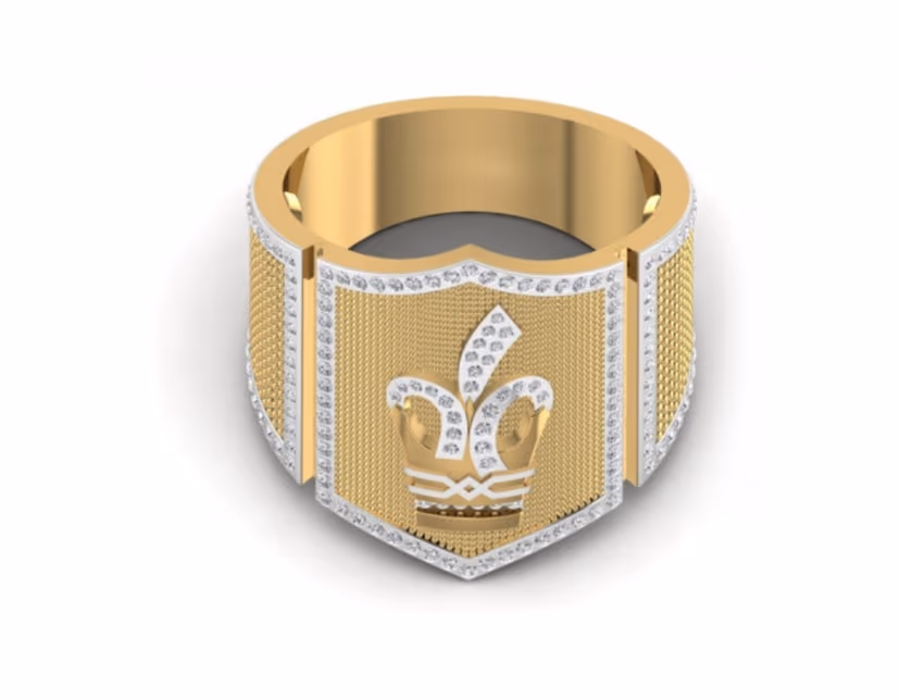 Gold-mesh shield signet with a raised crown emblem and pavé-bordered face.