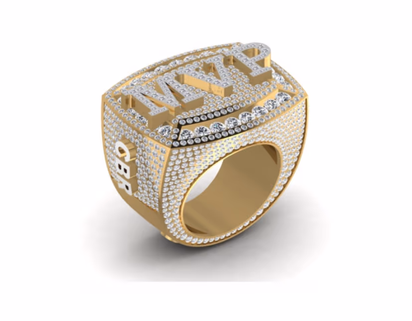 Championship MMVI signet with dense baguette panels and ribbon-edge detail.