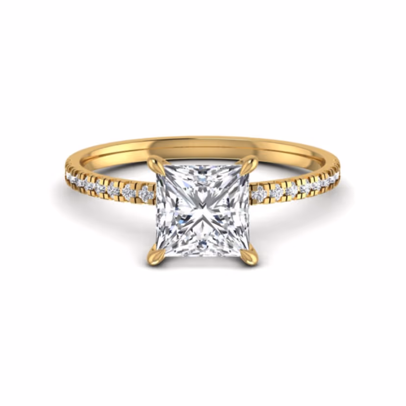Round halo solitaire ring with pavé surround.