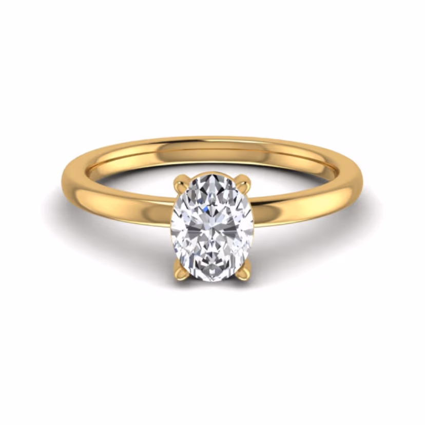 Knife-edge solitaire ring with four-prong setting.