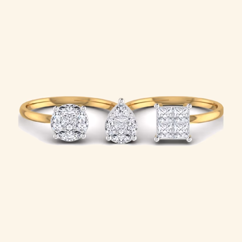 Three-stone princess diamond cluster cocktail ring on slim polished band.