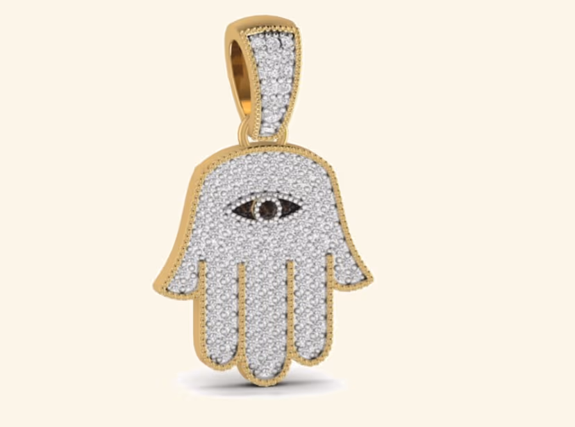 Pavé hamsa hand pendant with central evil-eye and milgrain-edged border.