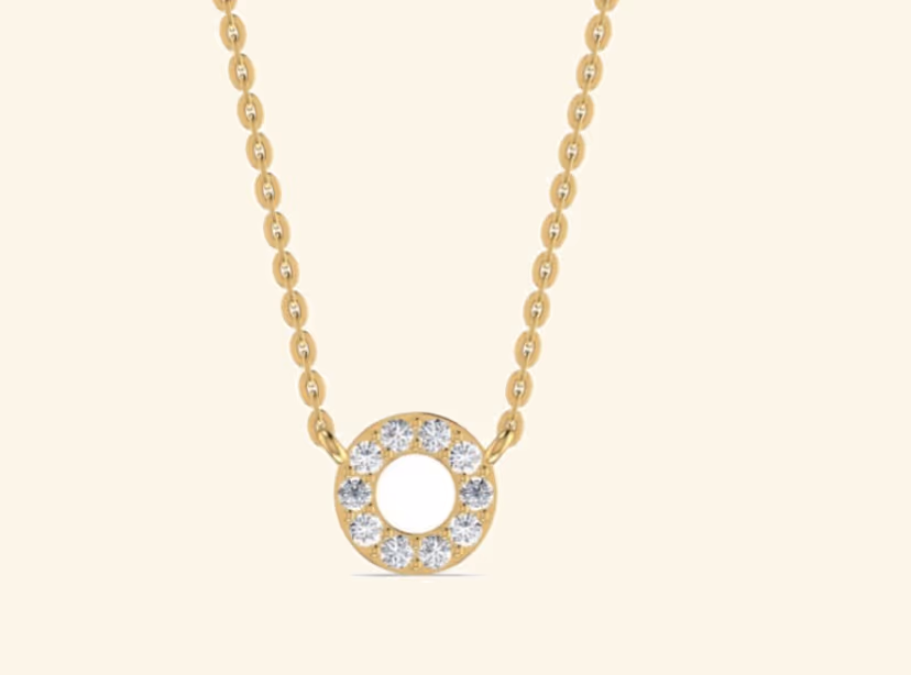 Open circle pavé halo pendant with hollow centre on cable chain.