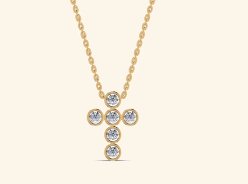 Six-bezel round cluster cross pendant on cable chain.