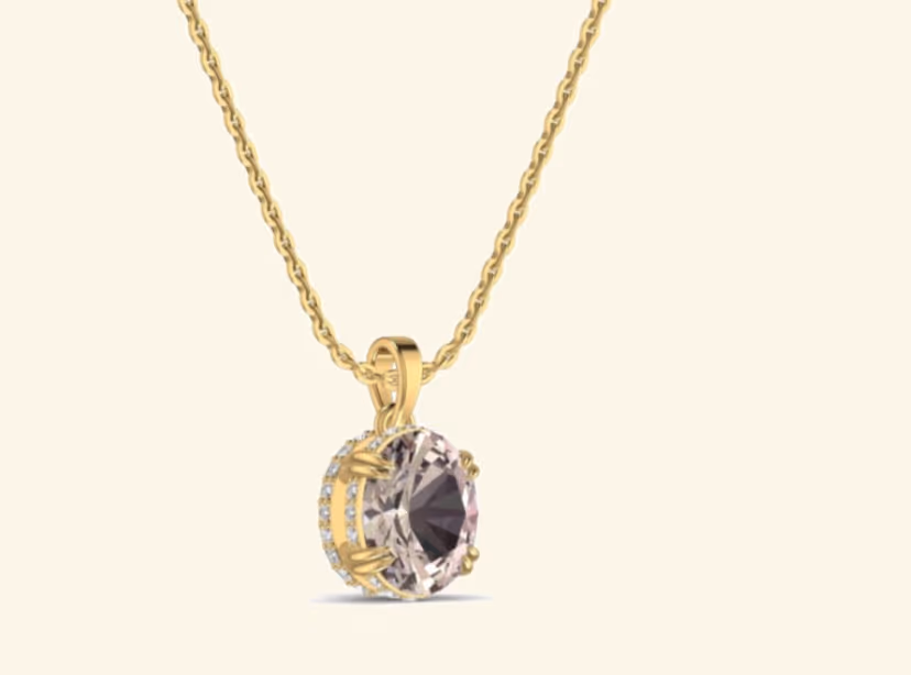 Round morganite solitaire pendant with pavé halo and prong-set bail.