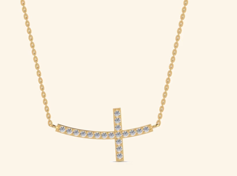 Sideways pavé cross pendant on cable chain with milgrain edges.