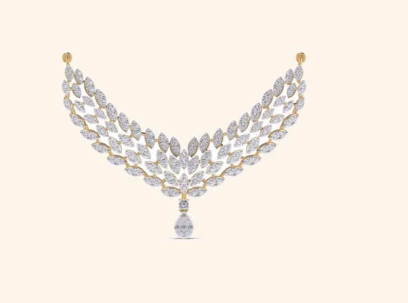 Marquise and leaf cluster bridal V-bib pendant with single pear drop.