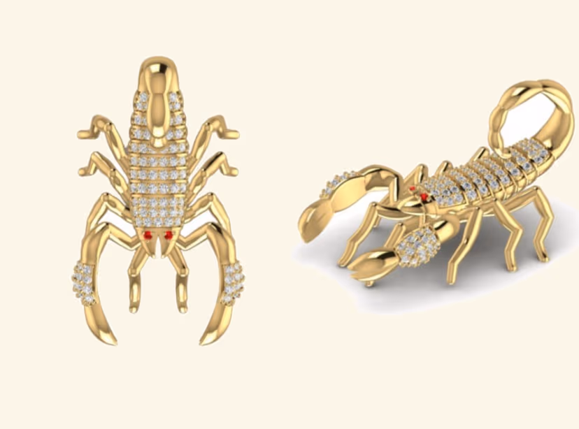 Pavé scorpion pendant pair with pavé back and ruby eye accents.