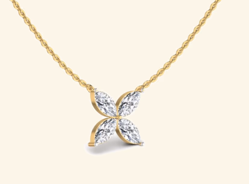 Four-marquise quatrefoil pavé pendant on cable chain.