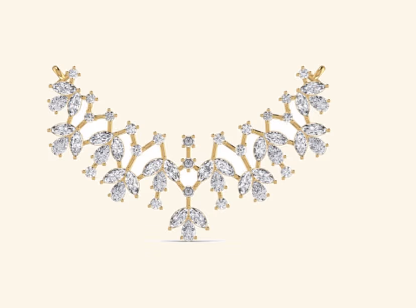 V-bib bridal cluster with marquise and pear leaves and central single round.