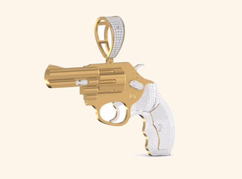 3D revolver pendant with pavé grip and sculpted gold barrel.