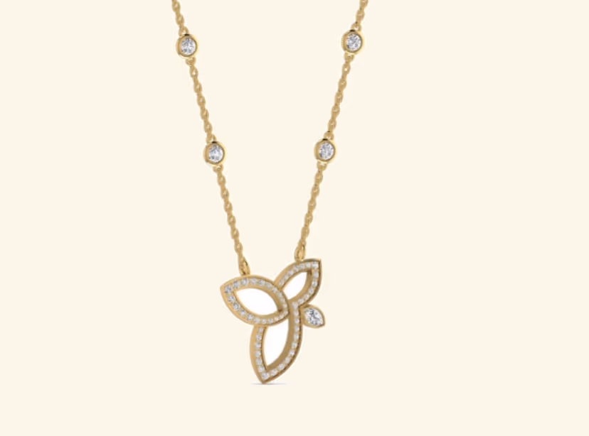 Three-petal floral pendant with diamond bezel station chain accents.