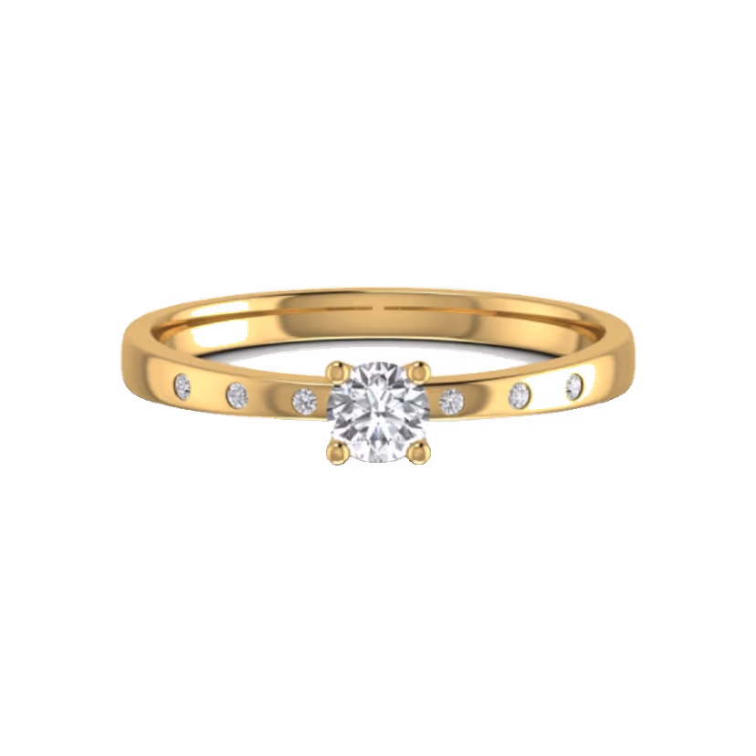 Tiny single-diamond accent ring on polished gold.